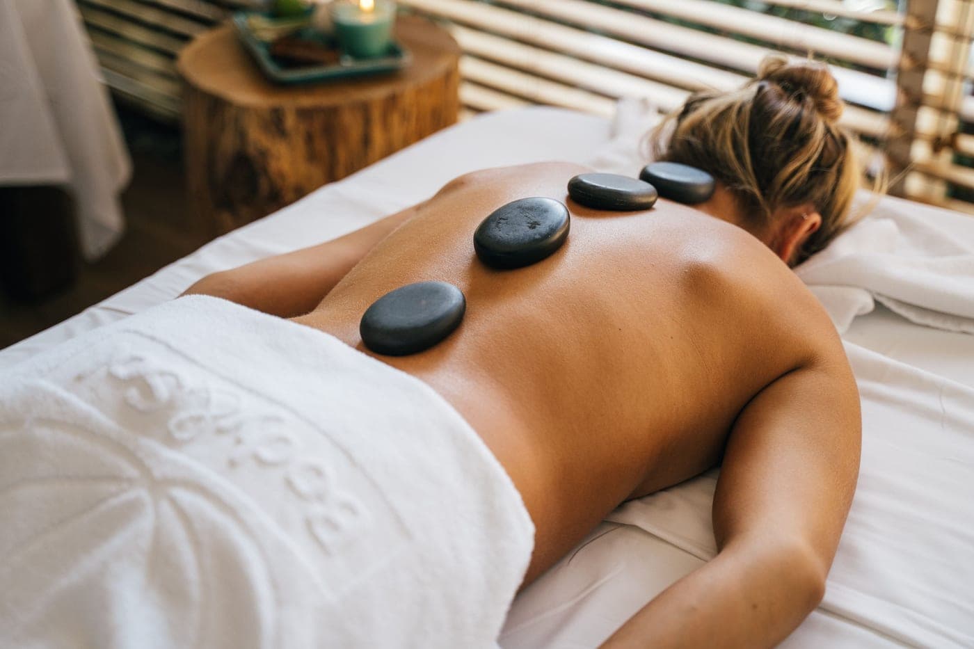 Smooth basalt stones warmed and arranged for a hot stone massage.