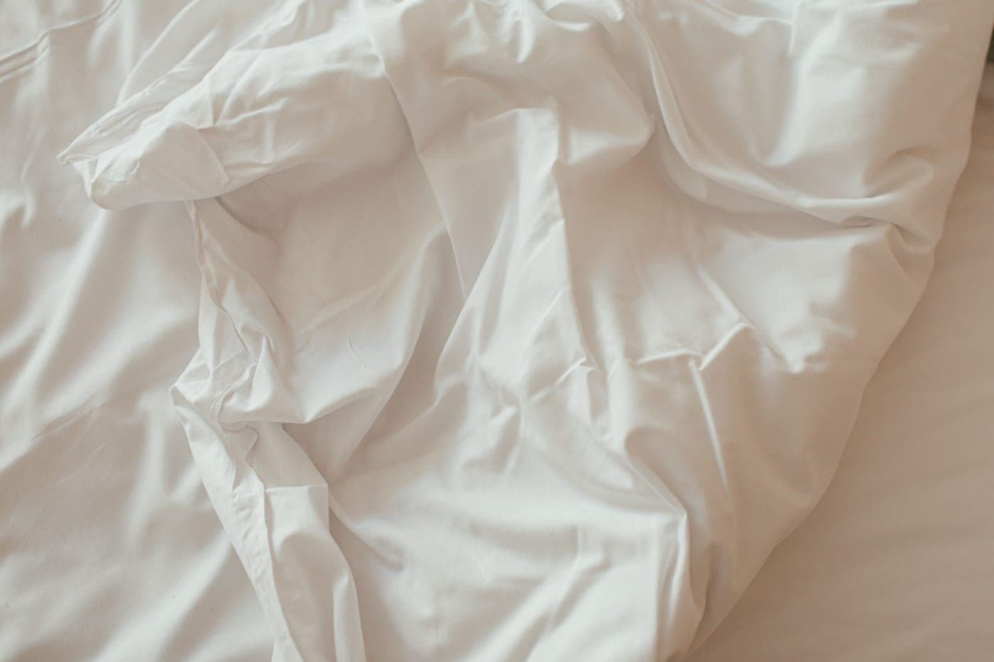 Soft white linen in natural light.